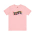 Election 2024 t-shirt with "VOTE" printed in large, colorful letters. Each letter features a different color from the rainbow spectrum, styled in a groovy 70s-inspired font.